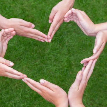 Coordinated hands resembling the shape of a heart.